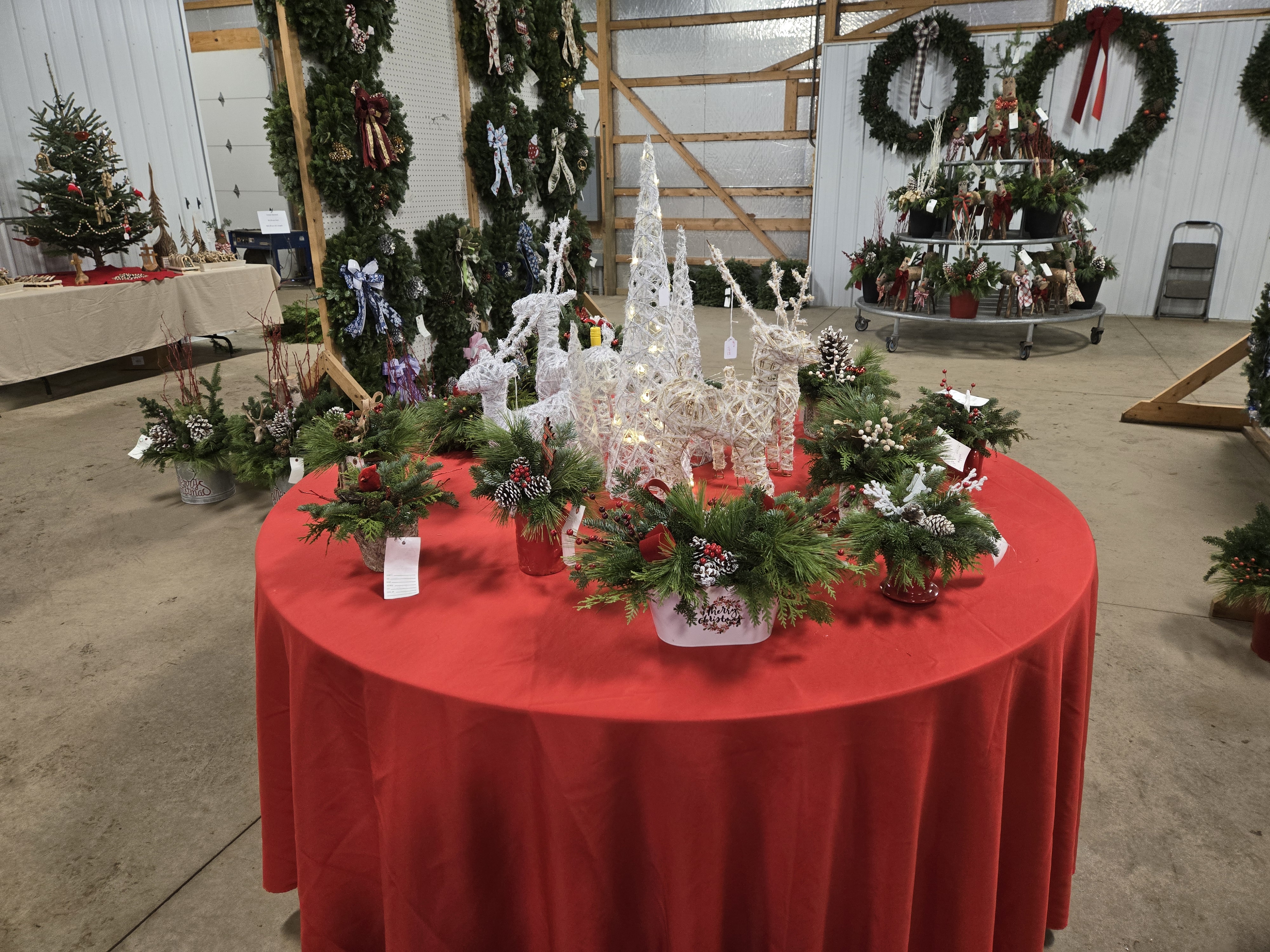 Christmas centerpieces and d&eacute;cor on display at a garden center.
